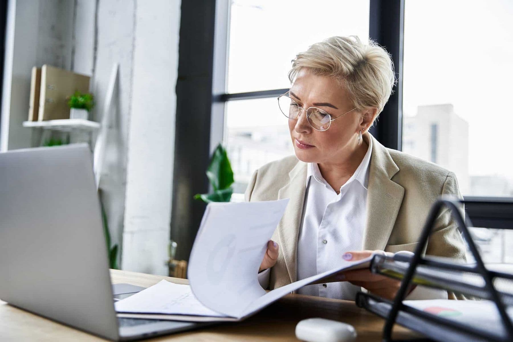 An experienced accountant reviewing her clients deferred revenue and deferred expenses to optimize their tax savings.