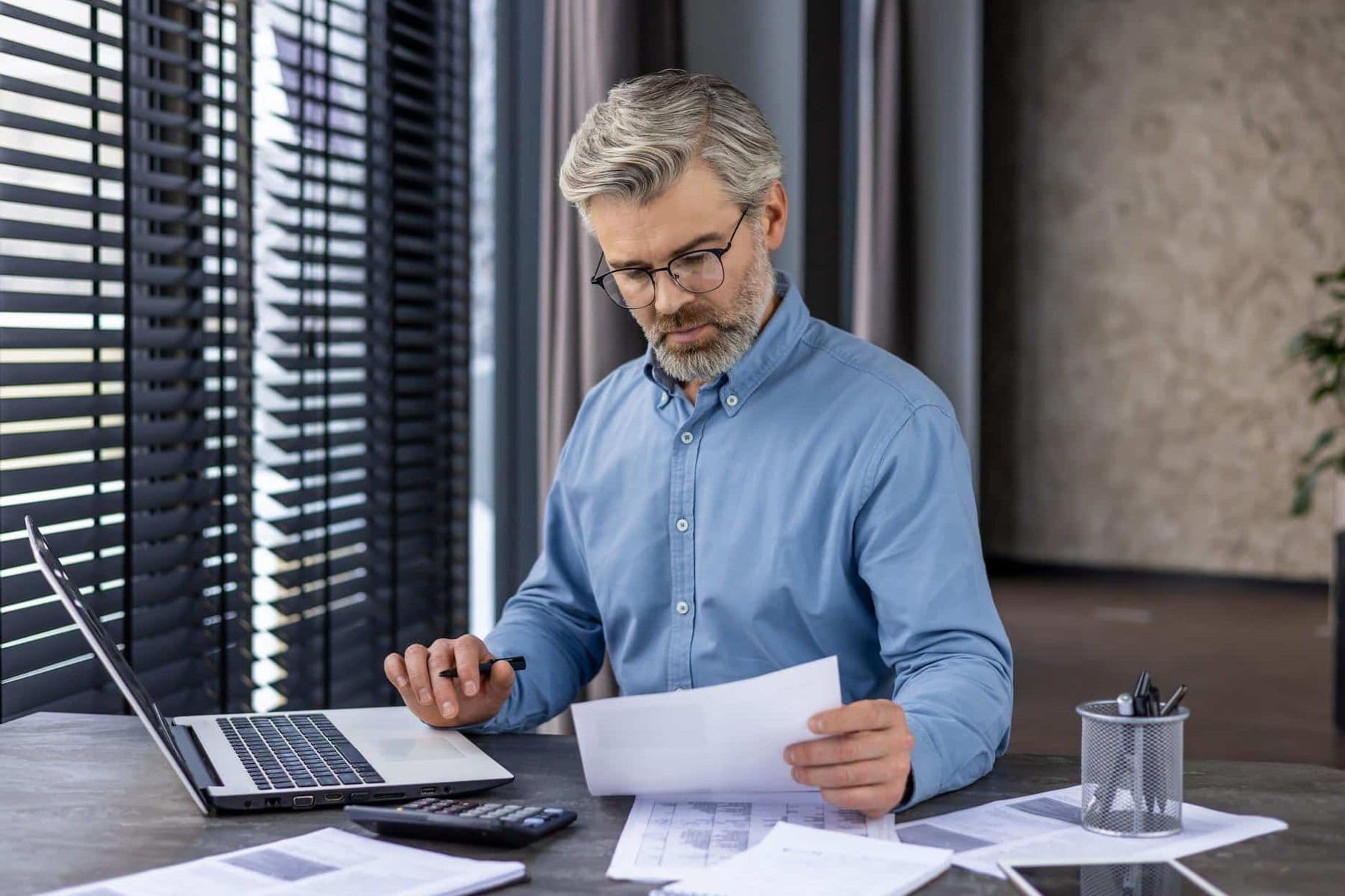 Taxready.ae employee assessing his clients sources of both direct and indirect tax in the UAE for tax planning.