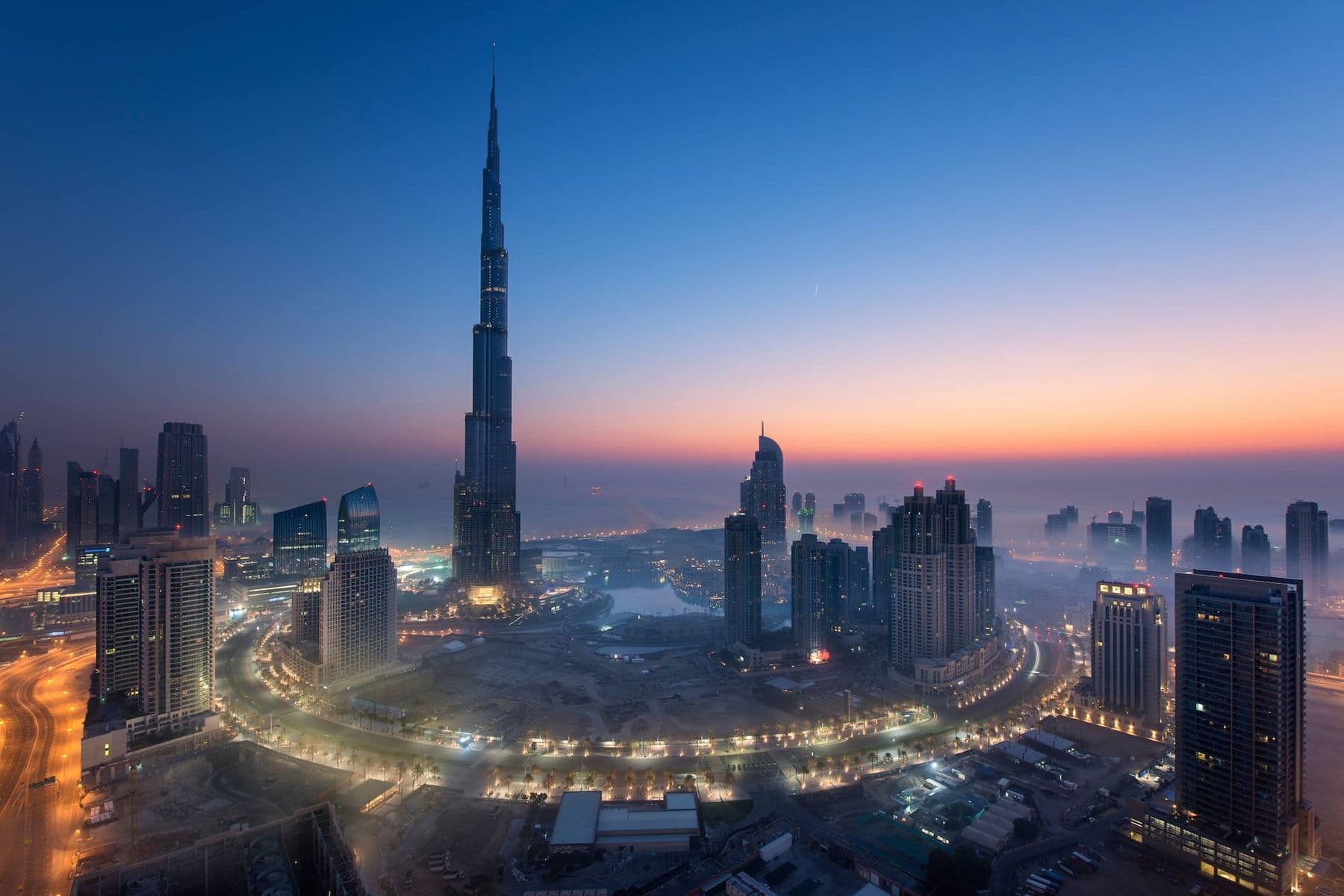 DTAA in the UAE illustrated by Dubai skyline with Burj Khalifa at sunset.